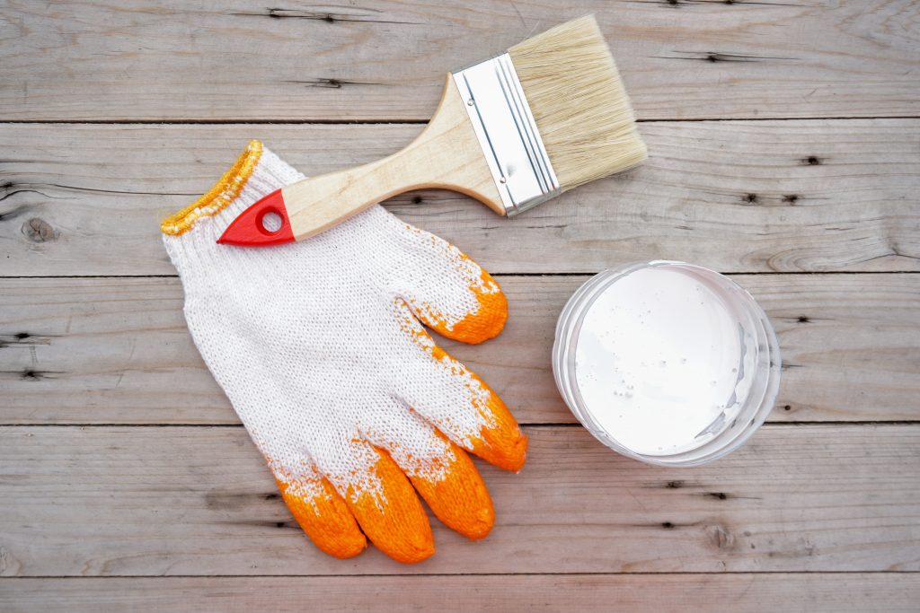 paint brush on gray wood floor