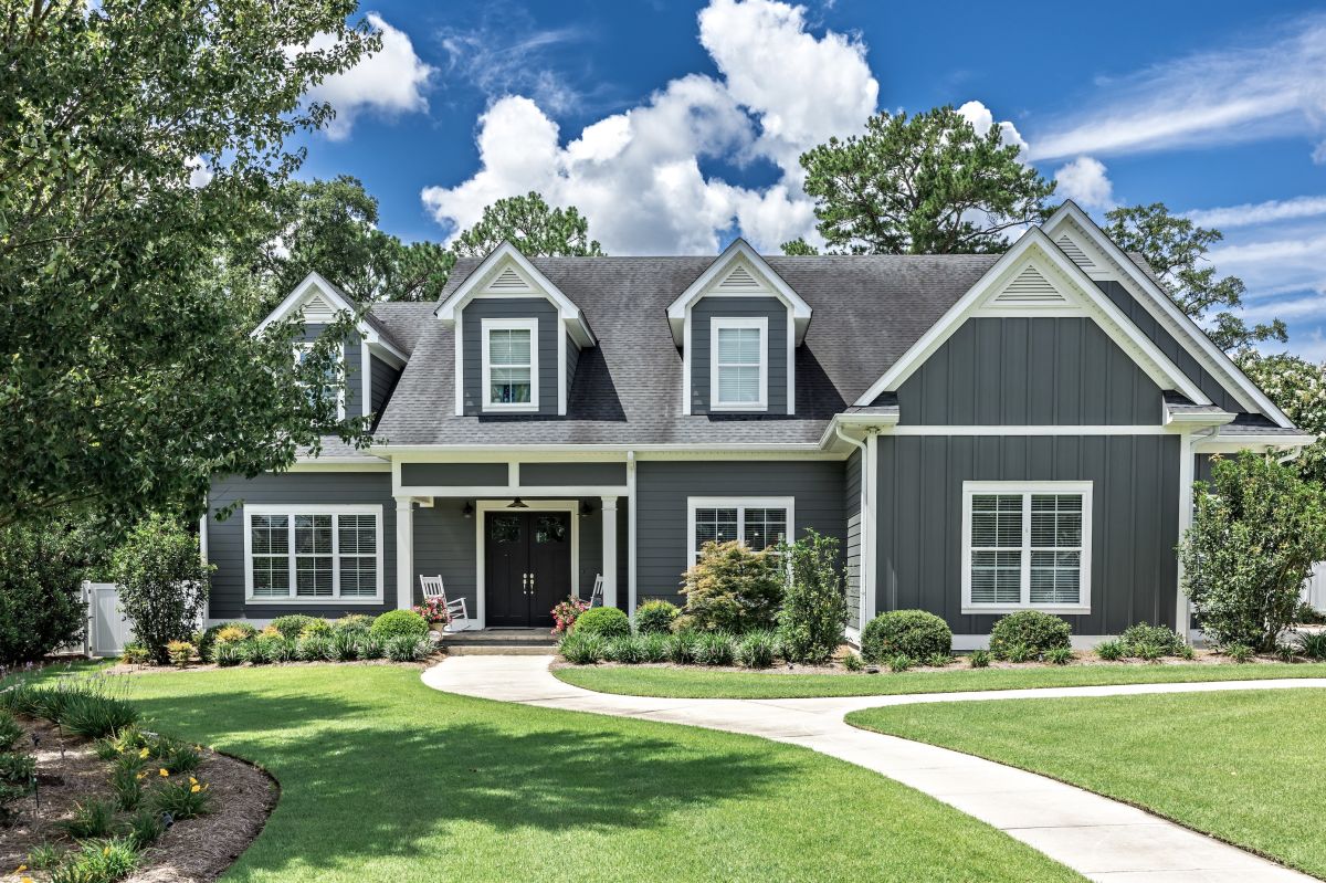 Grey siding exterior house and blue sky background