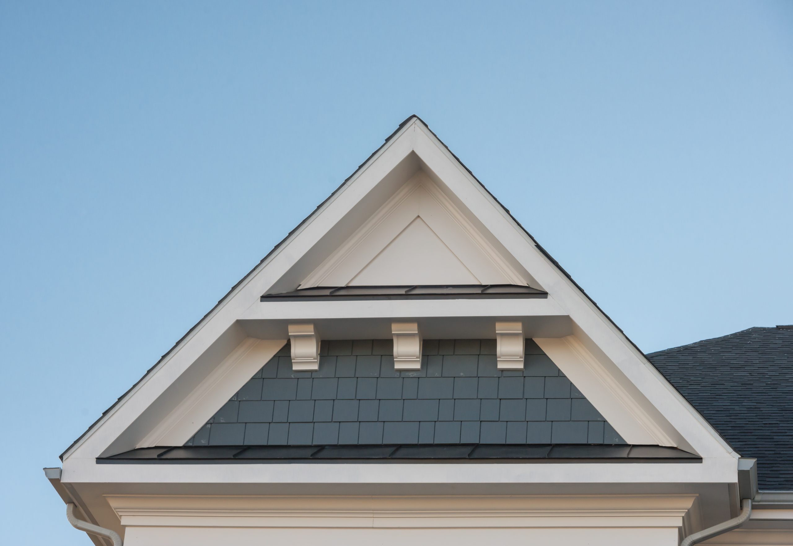 white fascia and shingles on gable