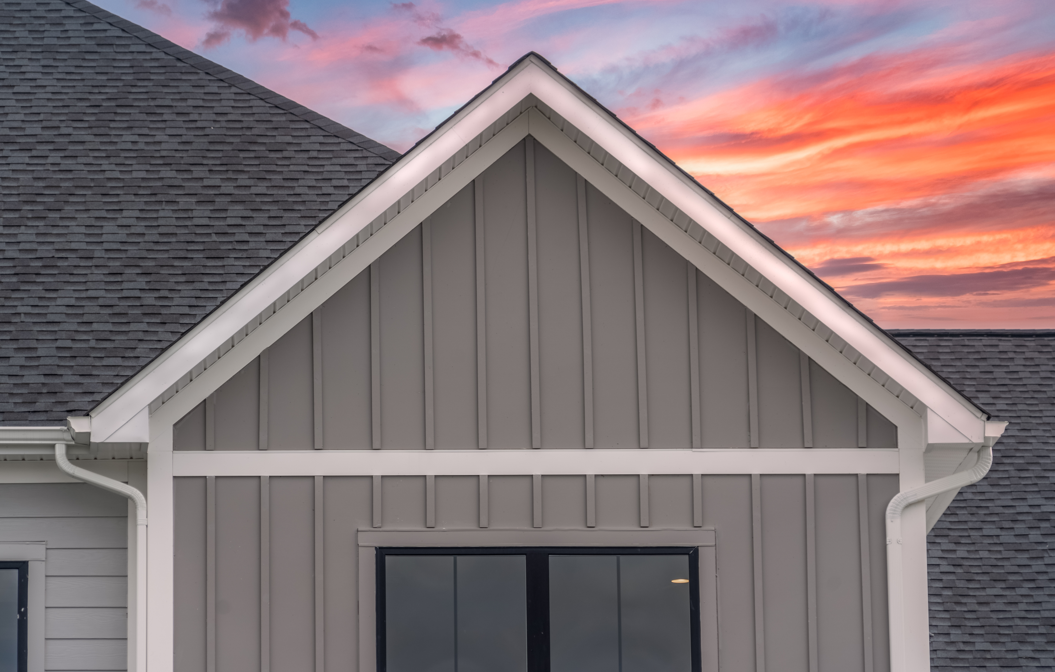 grey board and batten siding on house gable and wall